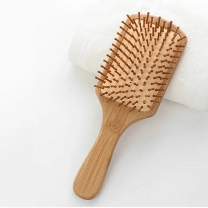 Eco- Friendly paddle Hair Brush With Organic Cotton Bag for Women, Men and Kids gives you Healthy Hair